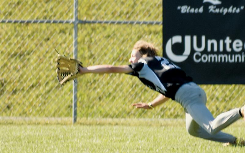 Benton Gibby lays it all on the line to snag a fly ball Tuesday against Hayesville. Gibby made the catch and Robbinsville went on to preserve an 11-7 win over the Yellow Jackets. Photos by Kevin Hensley/sports@grahamstar.com