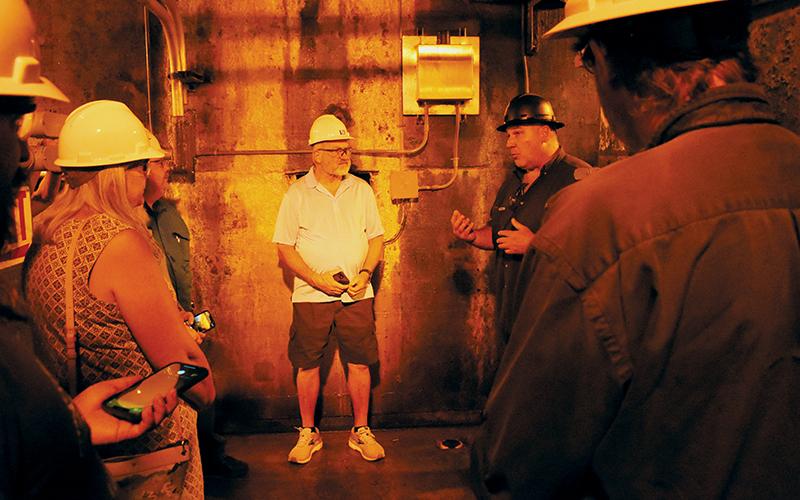 From within Fontana Dam, Tennessee Valley Authority Tech 3 Keith Sparks addresses one of four groups invited to the first tour of the structure in almost 22 years Friday.