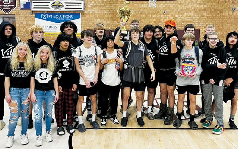 After five grueling matches Saturday, the Robbinsville High School Black Knights proudly display the Pool C, Devil Duals first-place trophy. Photo courtesy of Robbinsville Wrestling