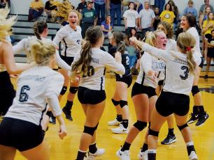 Jubilation sets in for the Robbinsvlle Lady Knights, moments after a thrilling 5-set  victory over Murphy on Sept. 5. Photo by Kevin Hensley/editor@grahamstar.com