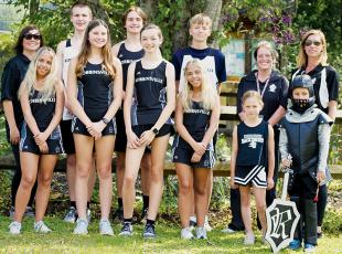 The 2023 Robbinsville High School cross-country team is comprised of (front row, from left): Skyler Oliver, Abby Wehr, Cassidy Kirkland, Kamree Oliver, Matilda Wehr and Oliver Wehr; (back row, from left): assistant coach  Jessica Wehr, Zeb Stewart, Bruce Helms, Colt Colvin, assistant coach Sunny Pringle and head coach Emily Wehr. Photo by Kevin Hensley/sports@grahamstar.com
