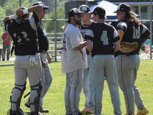 Robbinsville head coach Brent Icenhower goes over strategy with the Black Knights in-between innings at May 1's home game against Murphy. Photo by Jacquline Gayosso/The Graham Star